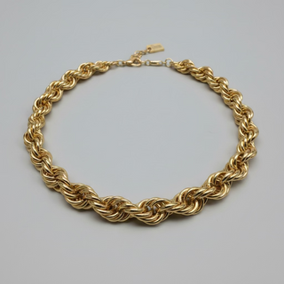 A chunky gold chain link choker necklace with a thick braided and twisted link design.