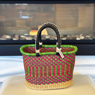 Woven basket with striped pattern on a surface